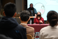 Audience members listening to Cathy Leamy at the opening panel.