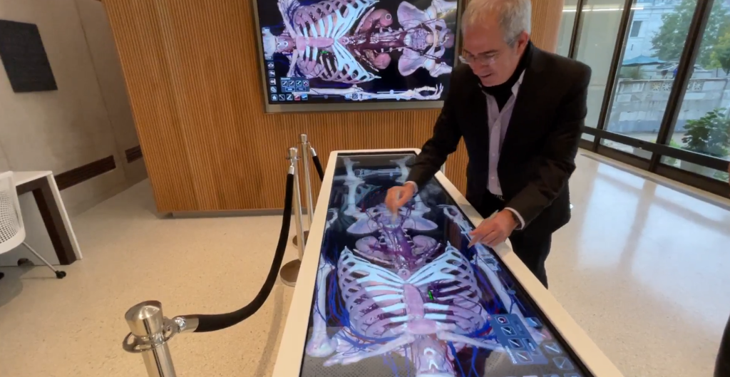 Anatomage Table and digital monitor in use in the Countway Makerspace.