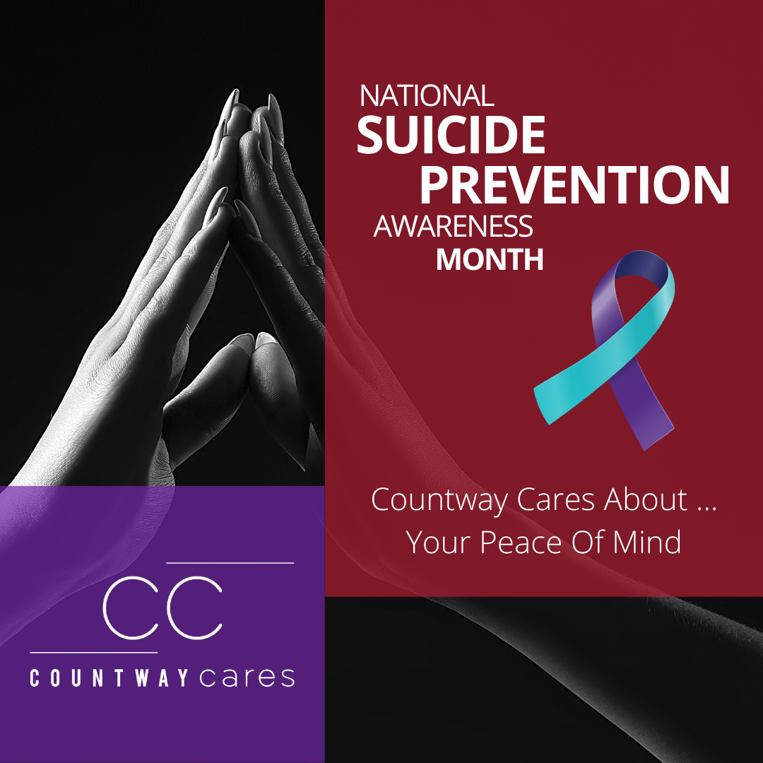 a hand reaching out to touch another hand during National Suicide Prevention Awareness Month