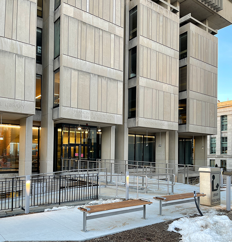 benches and snow outside Countway Library